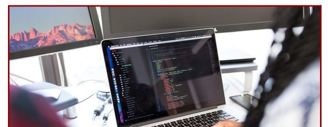 Person typing on a laptop displaying code, seated at a desk with large monitors. The image has a title: Ten Recommended Practices for Managing Preprints in Generalist and Institutional Repositories.