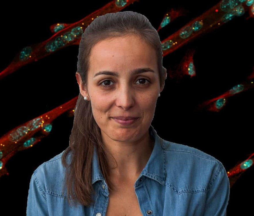 A person with long brown hair tied back, wearing a denim shirt, smiles softly against a background of glowing abstract lines and dots in red and teal.