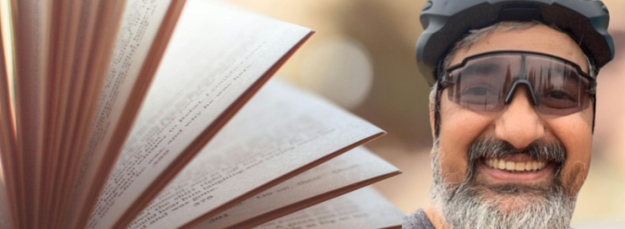 A stylized open book with pages fluttering adorns a headshot of Binay Panda