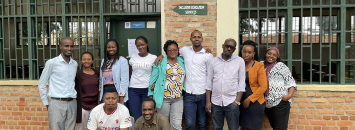 Group photo of investigators in front of a building